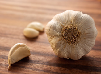 Large garlic head with a couple of peeled cloves