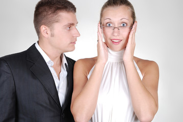 handsome businessman looking with desire at his young secretary