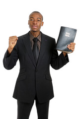 Man holding a bible preaching the gospel