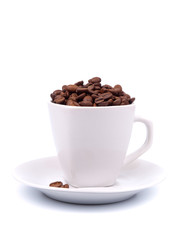 Cup and saucer with coffee beans