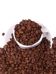 Cup and saucer with coffee beans