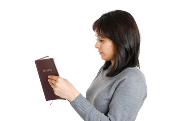 Young business woman studying a bible