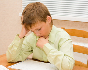 Young boy doing his homework