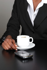 Business woman sitting with a cup of tea