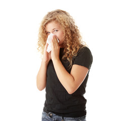 Young blonde woman having a cold