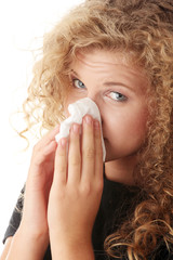 Young blonde woman having a cold