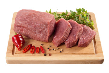 Raw beef on cutting board isolated on white background