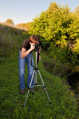 amateur photographer shoots a photo of evening scene