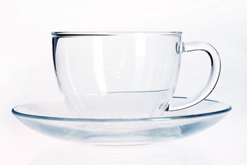 Empty Glass cup and saucer.