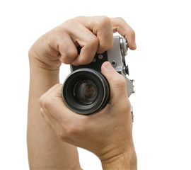 Photo camera in hands isolated on white background