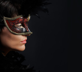 Portrait of elegant woman with venetian mask