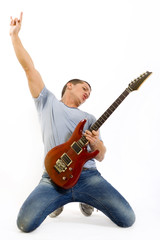 passionate guitarist playing his electric guitar