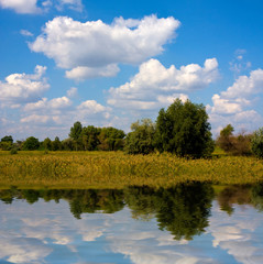 landscape with nice clouds over lake