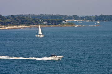 Sailboat and Cabin Cruiser in Bay