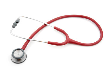 Red stethoscope over white background
