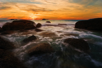 Tropical sunset on the rocks