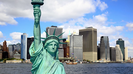 Fototapeta premium The Statue of Liberty and Lower Manhattan Skylines