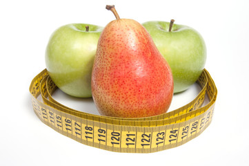 Green Apples and Pear with measuring tape, isolated on white