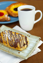 Chocolate croissant with a cup of coffee
