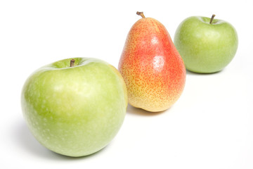 Arranged pear and green apples, isolated on white