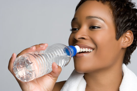 african woman drinking water