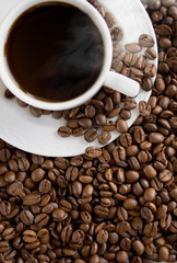 Hot coffee cup on the beans.