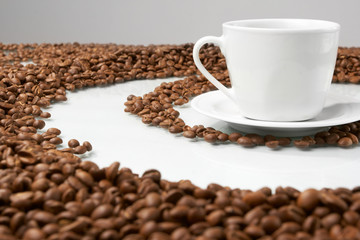 Cup with coffee, costing on coffee grain