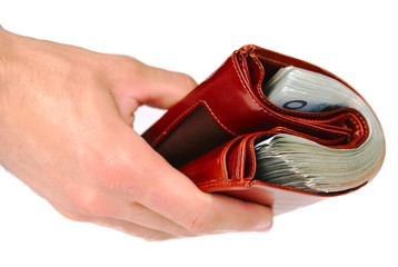 A brown wallet full of money isolated on a white background