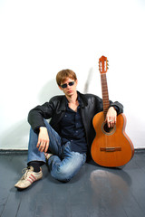 young red-haired guy with a guitar