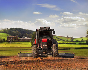 Obraz premium Tractor on Farmland, Somerset.