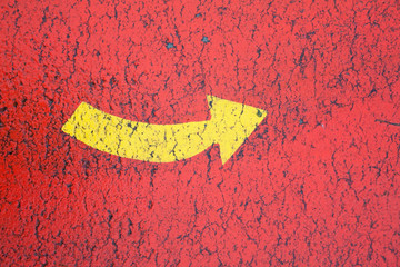 Yellow arrow in the red background