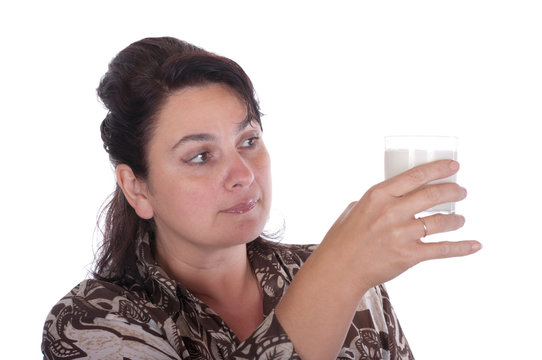 Woman examines a glass