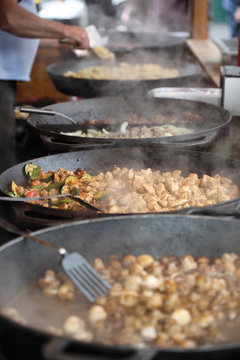 Food being prepared in large pans