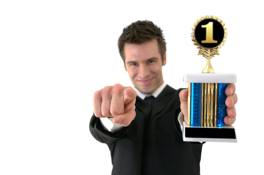Number one: Successful young man with a trophy