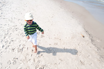boy running on beach