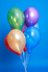 Obraz premium Group of colorful balloons isolated on blue background
