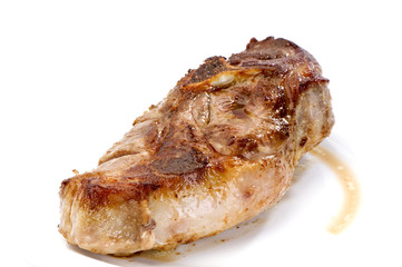 roast juicy meat close-up on a white