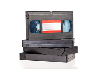 Old Video Cassette tapes isolated on white background - obrazy, fototapety, plakaty