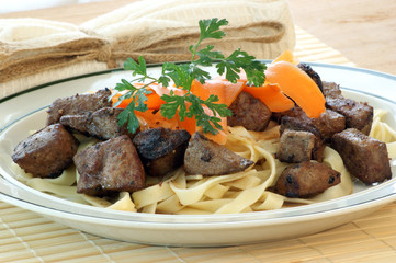 liver goulash on pasta with organic carrot