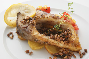 carp fillet on organic potato and lemon