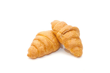 Two fresh croissant isolated over white background
