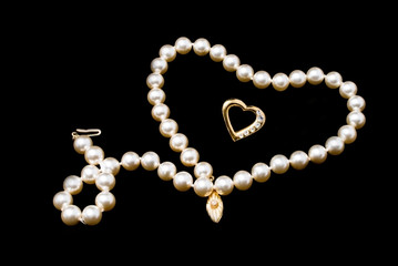 Pearls necklace on black background