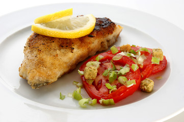 grilled carp fillet with organic vegetable on a plate