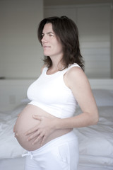 Portrait of beautiful pregnant young mature woman