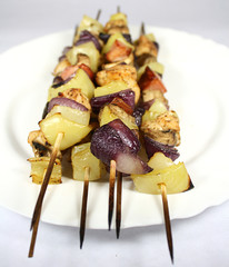 Skewers with bacon chicken and vegetables