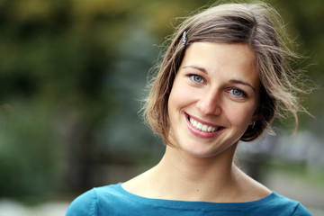 Closeup portrait of a happy young woman smiling