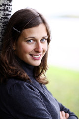 Closeup portrait of a happy young woman smiling