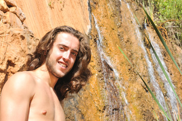 Portrait near a waterfall