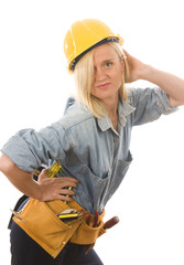 attractive woman contractor with tools and hard hat helmet