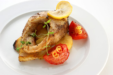 carp fillet on organic potato and lemon